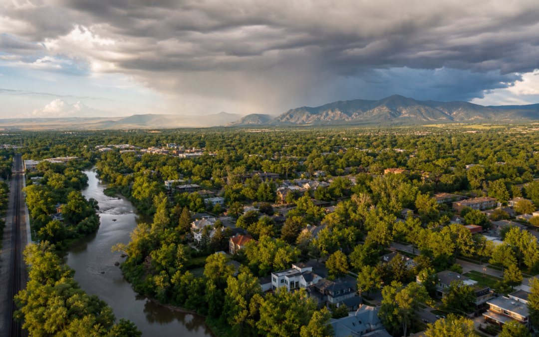Aerial view of Fort Collins Colorado residential neighborhood with summer storm clouds building over the Rocky Mountain foothills