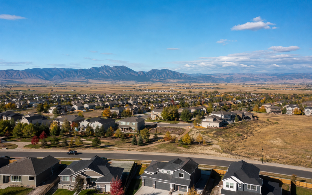 New residential construction and family homes in the growing town of Severance Colorado with the Rocky Mountain foothills on the horizon